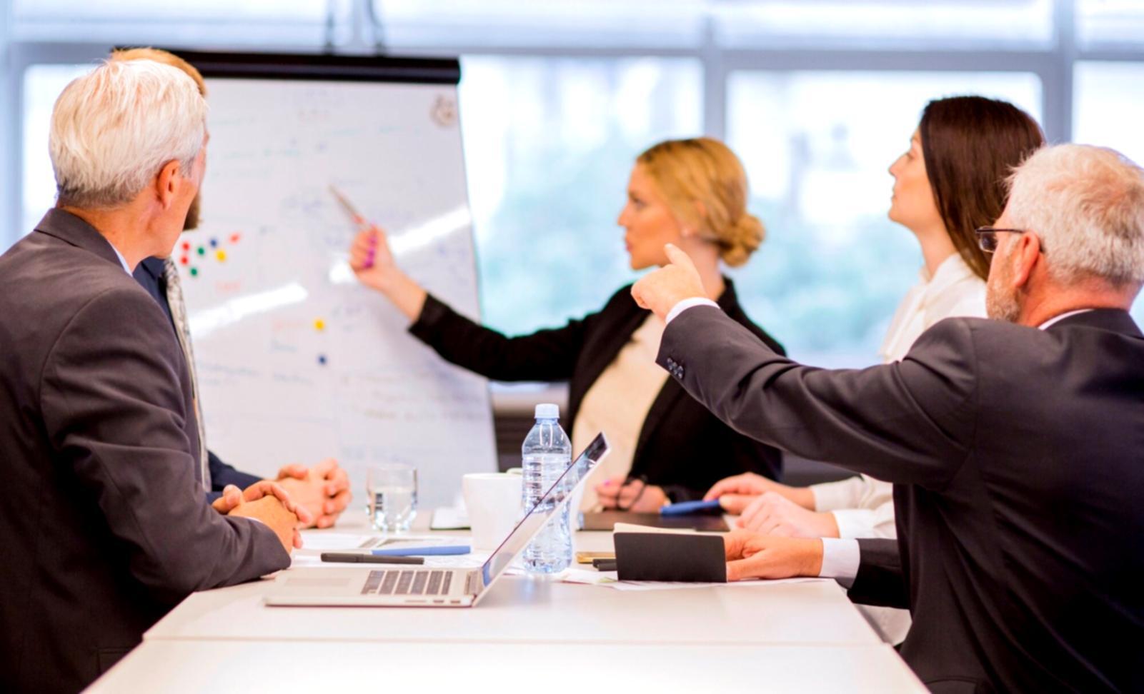 Business professional reviewing budget analysis documents