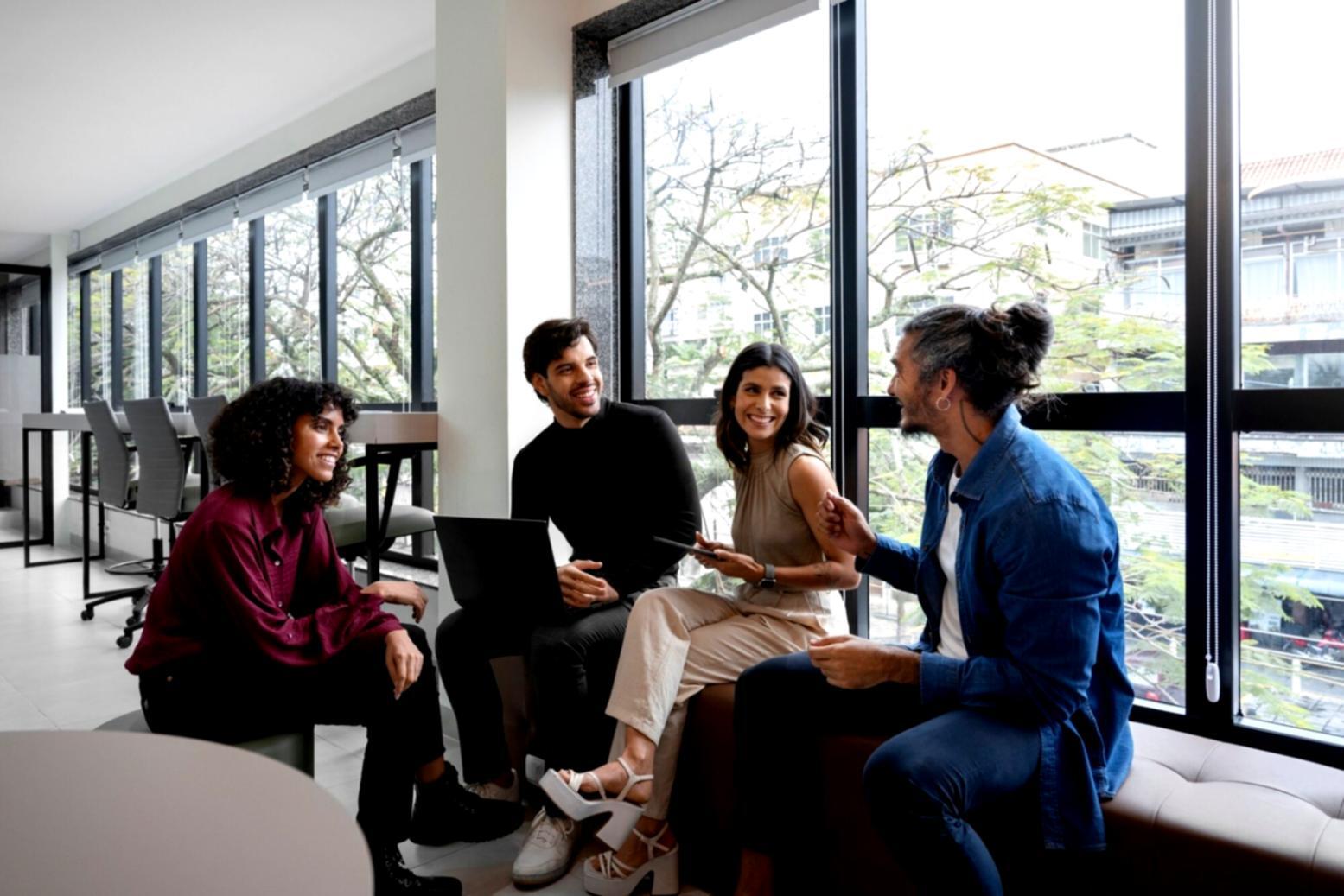 Professional presenting budget analysis to executive team in modern boardroom